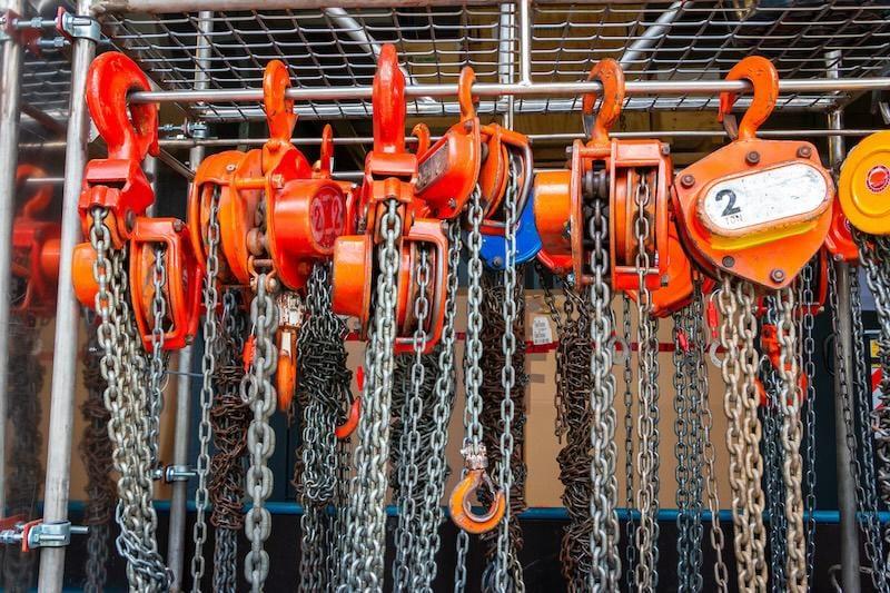 Rack of industrial chain hoists and lifting tackle